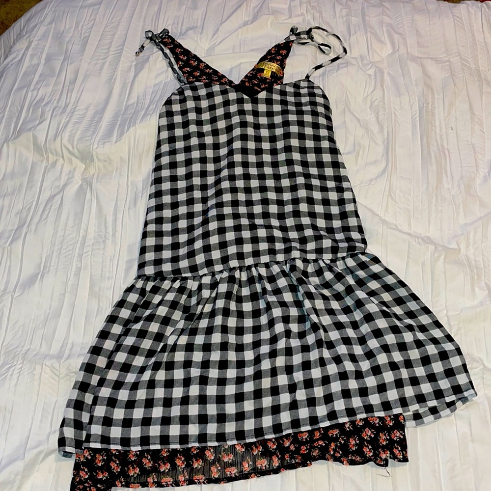 It’s and xs dress that is plaid with flowers.